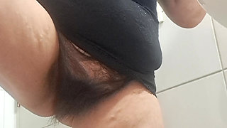 MILF, brushing teeth, and this hairy woman is just begging to be fucked.