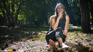 Seductive Russian Beauty Smoking Cigarette in Studio